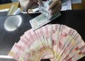 Rupiah Hari Ini Tertekan terhadap Dolar AS karena Tarif Impor Trump